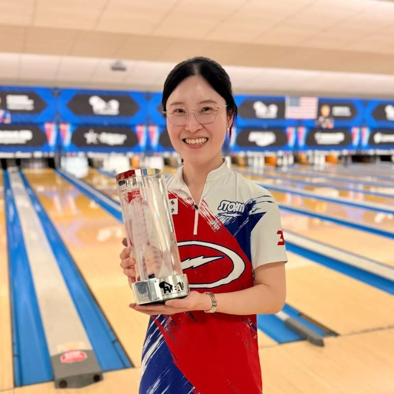 Seo Yeon Ryu holding her 2026 PWBA Rookie of the Year trophy